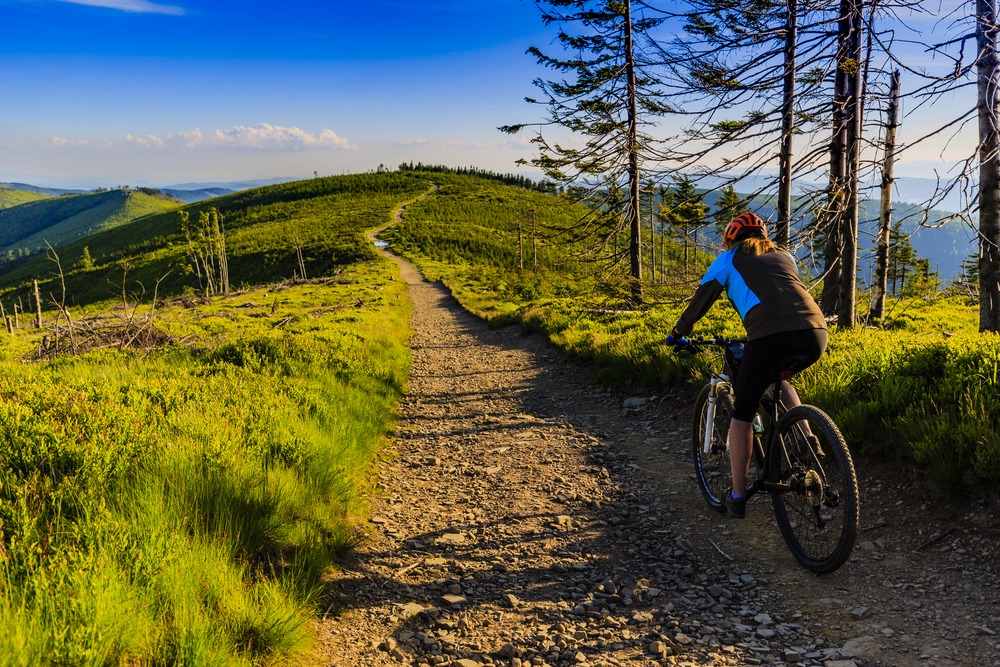 Female Biker with Blue Sky